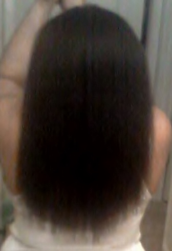 An impromptu length check using my cell phone. Checking to see that I finally have waist length hair. www.growitgirl.com 